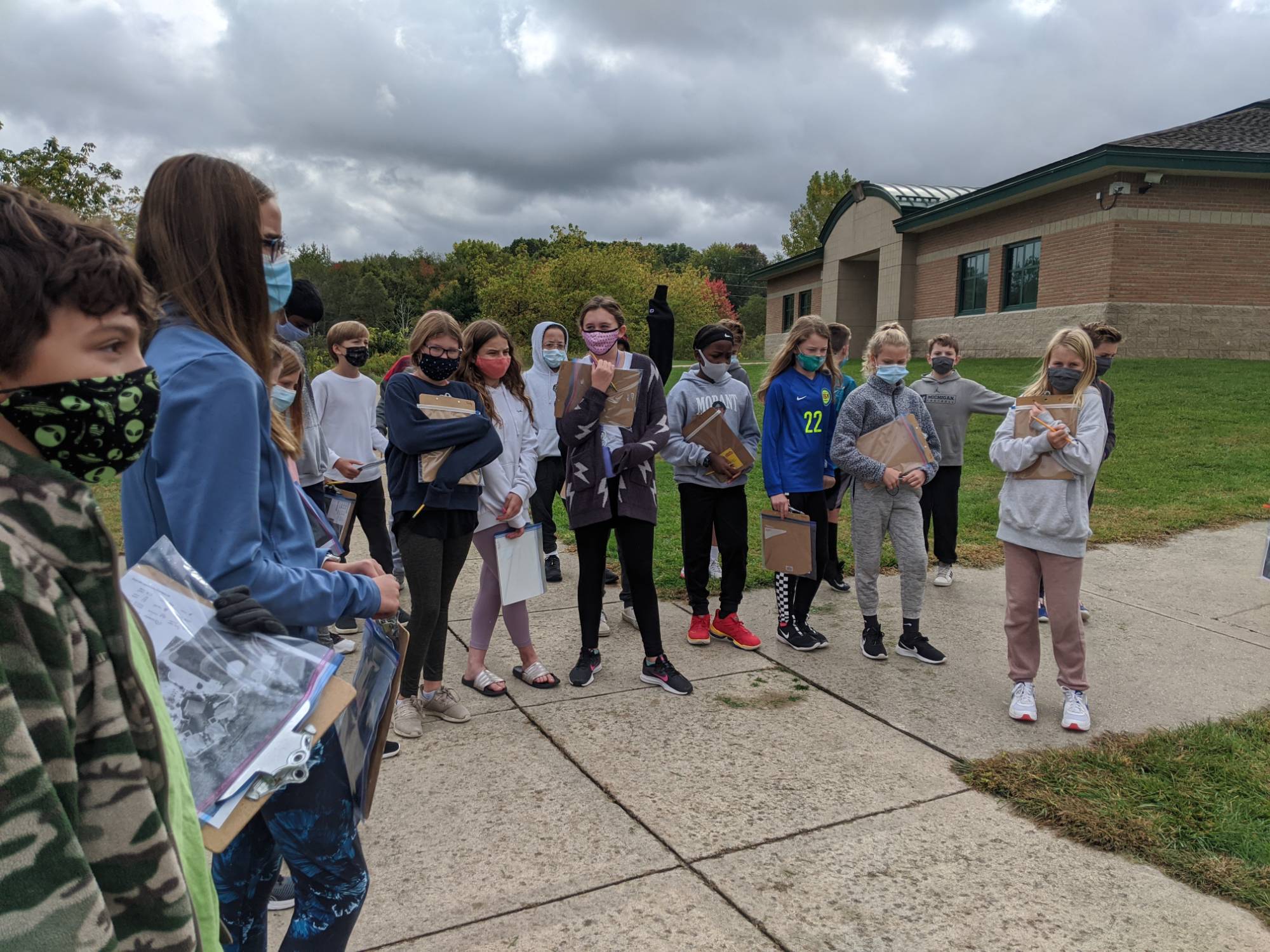 Students standing outside their school building